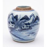 A Chinese blue and white jar: painted with a mountainous lake landscape with a fisherman and