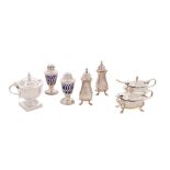 A mixed lot of silver condiments, various makers and dates: includes two pairs of pepperettes,