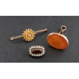 Two brooches and a seal fob,: including an Etruscan revival style brooch, stamped '9C', length ca.