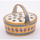 An English porcelain pot pourri basket and pierced cover: of oval form with overhead handle,