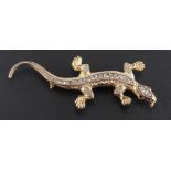 A rose-cut diamond and ruby lizard brooch,: estimated total diamond weight ca. 0.25cts, length ca.