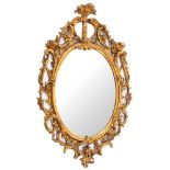 A giltwood and composition framed oval wall mirror in Rococo style, second half 18th century,
