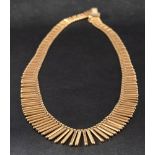 A mid-20th century, fringe necklace,: stamped '750', with Italian control stamps for 1944-1968,