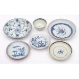 A group of Chinese porcelain wreck cargo: comprising a Nanking Cargo saucer painted in blue with