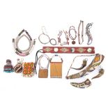 A collection of bead work items: includes belt with cowry shell panels, gourd covered with beads,