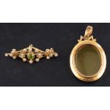 A 15ct gold locket together with a peridot and seed pearl brooch,