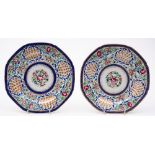 A pair of Chinese porcelain plates for the Arabic market: brightly decorated in famille rose