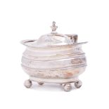 A George III silver mustard pot and cover, maker Solomon Hougham, London, 1814: crested,