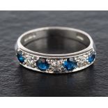 An 18ct white gold, sapphire and round, brilliant-cut diamond, half-eternity ring,