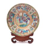 A Chinese Canton famille rose/verte punch bowl: enamelled overall in traditional bright colours