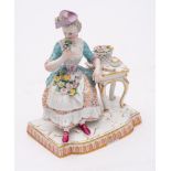A Meissen figure allegorical of the Sense of Smell from the set of the five Senses: after the