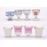 A group of eight Spode & Copeland egg cups: including a pair of Copeland & Garrett 'Felspar' cups