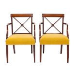 A pair of Regency mahogany and upholstered library elbow chairs, circa 1815,: the square,