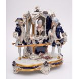 A Royal Dux Bohemia porcelain group: modelled as two porters flanking a sedan chair containing an