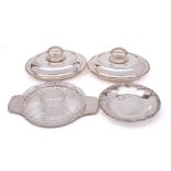 A pair of silver plated entree dishes and covers: of oval outline with beaded borders,