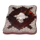 A late Victorian tortoiseshell and silver mounted blotter: bears marks for William Comyns & Sons,