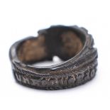 A 18/19th century wooden mourning ring: carved with a hand offering a bouquet and the inscription