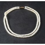 A double row, cultured pearl necklace,: the cultured pearls of white hue with pinkish overtones,