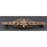 An openwork, seed pearl and blue topaz brooch with stylised floral decoration,