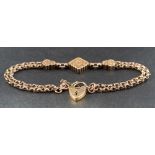 A fancy-link gold bracelet with three foliate engraved panels,
