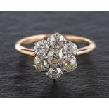 An old-cut diamond cluster ring,: total estimated diamond weight ca. 1.