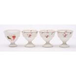 A set of three Daniel egg cups and one similar: painted with floral sprigs and vines,