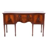 A mahogany and line inlaid serpentine front sideboard in George III style, by Rackstraw,