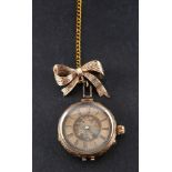 An early 20th century ladies pocketwatch,: the gold-coloured dial with floral decoration to centre,