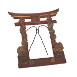 A Japanese bronzed metal photograph frame in the form of a Torii (Temple gate): decorated with