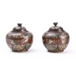 A pair of Japanese cloisonne jars and covers: of squat globular form, with domed lift-off covers,