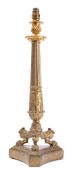 An early 19th century gilt-bronze candlestick: the foliate decorated urn-shaped sconce mounted on a