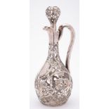 An American Art Nouveau clear glass and silver overlay decanter and stopper: with slender neck and