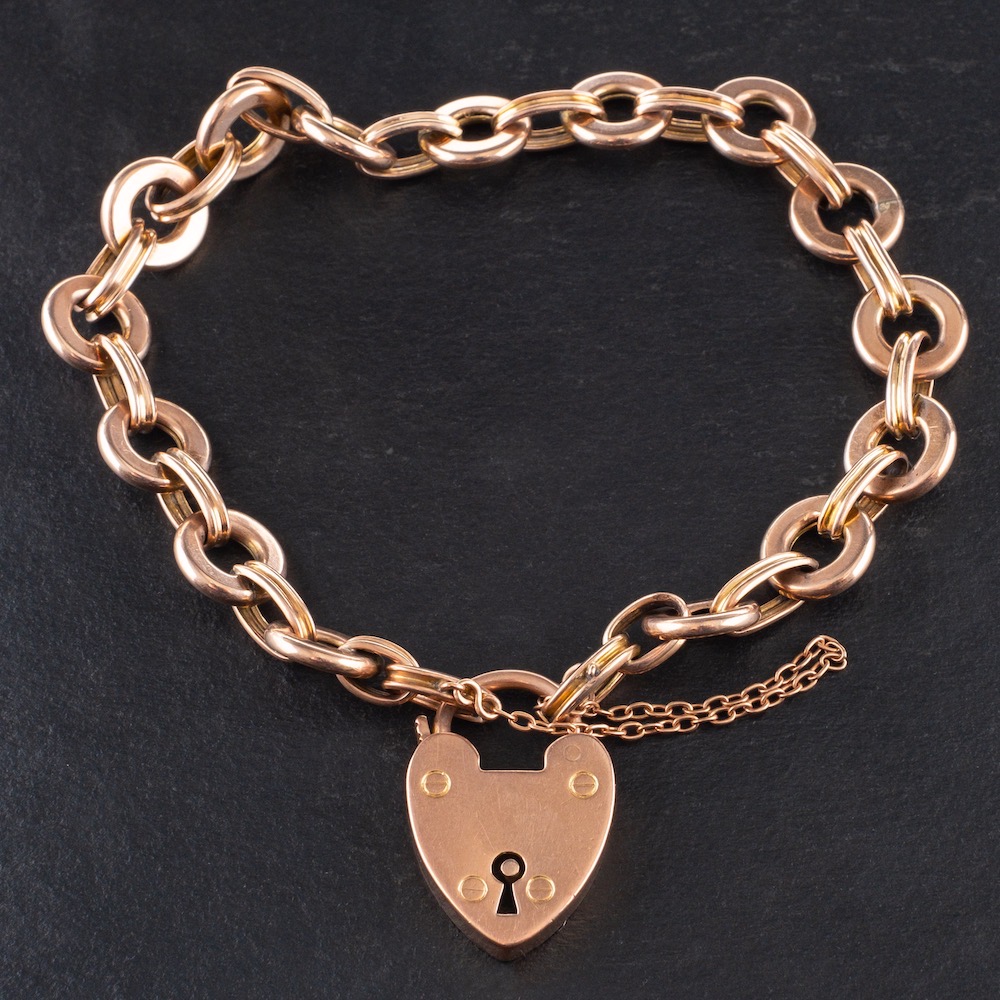 A 9ct gold fancy-link bracelet with heart-shaped fastener,: with hallmarks for Birmingham, 1907,