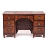 A mahogany pedestal desk in George III style,