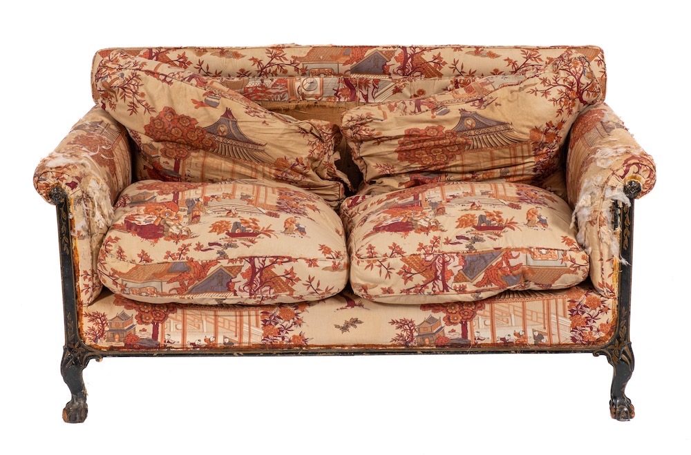 A rare Edwardian lacquered, parcel gilt and upholstered two seat sofa by Howard & Sons of London,