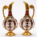 A pair of Royal Crown Derby ewers: in the 'Old Imari' pattern with solid gold borders,