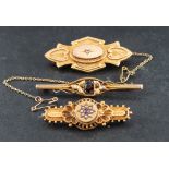 Three brooches,: including a Victorian, 15ct gold, ruby and seed pearl brooch,