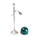 A silver plated student's lamp: with s-shaped reeded arm with green glass shade,