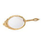 A gilt-bronze framed hand mirror: of oval outline the bevelled mirror plate surmounted by an arched