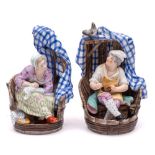 A pair of Continental porcelain figure groups: modelled as a cobbler and a seamstress within a