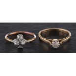 Two diamond rings,: a ring with four old-cut diamonds in the shape of a clover,