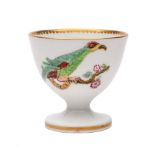 A rare Swansea egg cup: with coloured transfer decoration of two parakeets chained to knarled