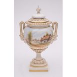 A Royal Worcester porcelain two handled vase and cover: of pedestal form the handles with female