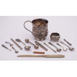 A Burmese silver mug: initialled, decorated with figures in a village scene,