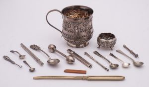 A Burmese silver mug: initialled, decorated with figures in a village scene,