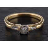 An 18ct gold, princess and tapered baguette-cut diamond ring,