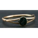 A Victorian, 18ct gold, bloodstone seal, hinged bangle bangle,: the seal engraved with name 'Ellie',