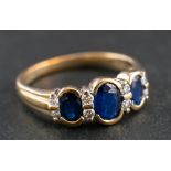 A 9ct gold, sapphire and round, brilliant-cut diamond ring,: total diamond weight ca. 0.