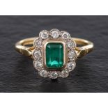 A 18ct gold emerald and round, brilliant-cut diamond cluster ring,: calculated emerald weight ca 0.