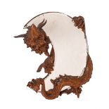 A French carved and stained wood dressing table mirror modelled with a dragon,